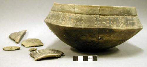 Ceramic partial vessel and sherds, incised design