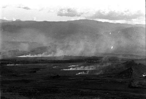 view across Valley; garden fires; on R, Siobaka Hill