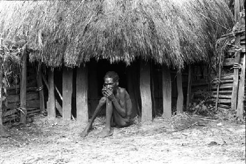 Abugulmo 2. Old Jalio sits before men's house.