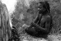 Woman burning salt on rock above Wubakaima.