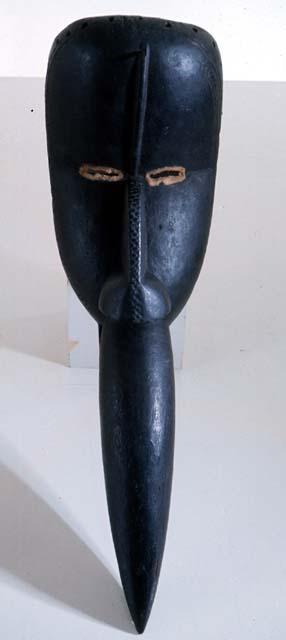 Black wooden mask with bird-like beak (Nos gbo Ge) - "Bird beak Devil".  Sent to