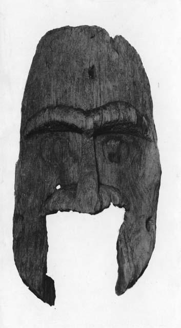 Carved wooden mask. (similar to Kagaiuil Cave board masks, Smithsonian)