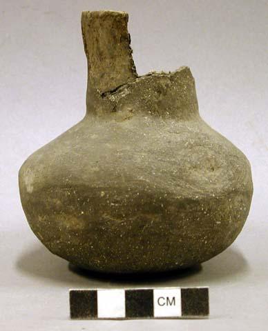 Ceramic jar, short straight neck, plain. 2 sherds inside.