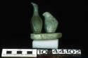 Stone carving - owl and loon (green) on grey stone platform