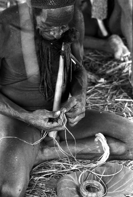 Karl Heider negatives, New Guinea; Asokmeke waving a nyeraken are