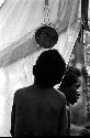 Karl Heider negatives, New Guinea; Child looks in mirror