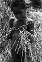 Karl Heider negatives, New Guinea; Milika's son making grass stem toys