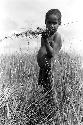 Karl Heider negatives, New Guinea; Milika's son making grass stem toys