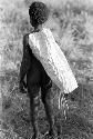 Karl Heider negatives, New Guinea; Young man with long sheet of white paper