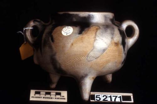 "Snake pot" with tripod base and 2 lug handles. Incised treatment of snake's bod