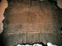 Bison robe. Decorated w/ vertical rows of quillwork, pieces of red cloth