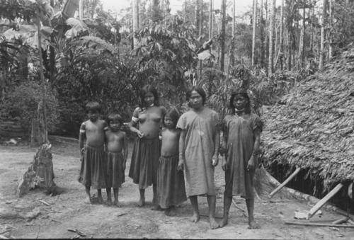 Views of men, women and children showing typical costumes and ornaments.