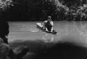 Koto indian paddling a canoe