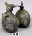 Double spouted black pottery whistling jar