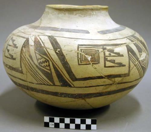 Black on yellow pottery jar, restored