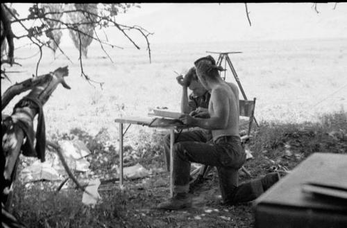 Tooele camp -- Longyear and Mulloy at map table