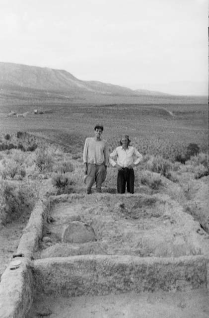 House I, view of R. II., S. part of R. I in foreground -- roof hole cover turned on edge in right fore corner of R. II