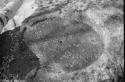 Grinding stone, cut in native rock lying beside creek near Bully Boy Mine