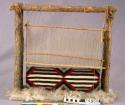 Miniature loom scene with chief's blanket textile