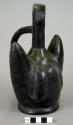 Black ware vessel with stirrup spout