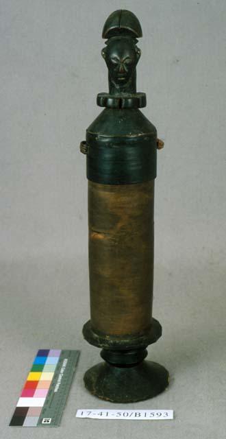 Bent-wood cylinder box with carved human head on lid