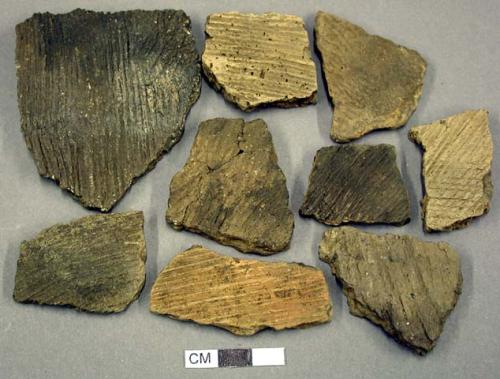 Ceramic, earthenware body sherds, cord-impressed; some mended