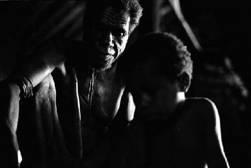 Child and a man in hunu