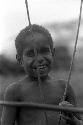 Portrait of a small boy smiling; head and shoulders