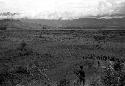 Extreme wide angle; men on the Warabara; the battle raging below Supula shows