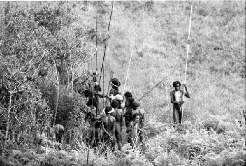 A group that is gathered down below the Warabara toward the NE; wounded man in the midst