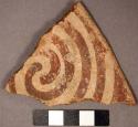 Ceramic rim sherd, spiral red on buff painted decoration