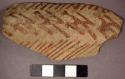 Ceramic body sherd, exterior red on buff linear design