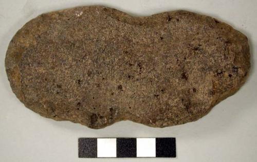 Stone tool, oblong and flat, notched at center, edged chipped & partially ground