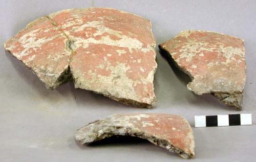 Pottery fragments with red pigment