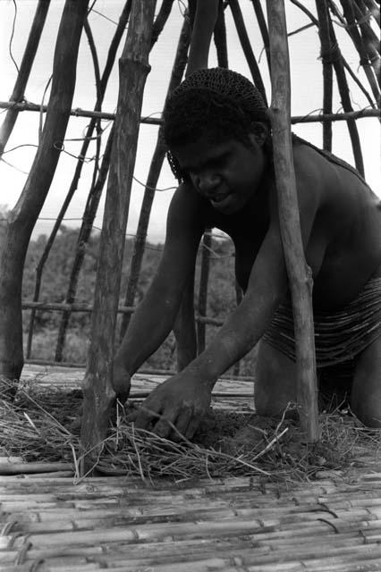 Woman working on roof