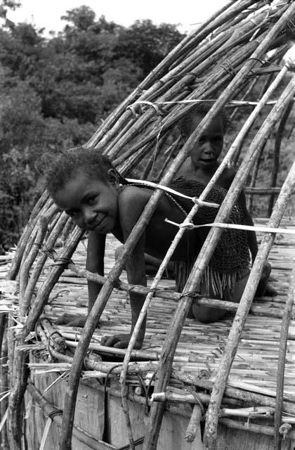 Little girl looking through rafters