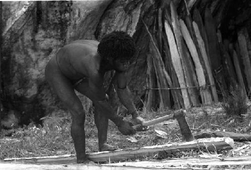 Man splitting wood