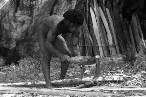 Man using wooden tools