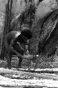 Man using wooden tools