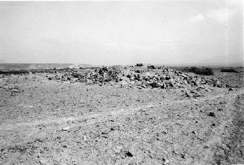 Platform and row of upright slabs at Site 76