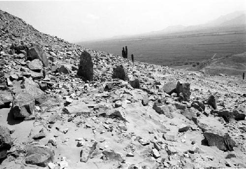 Wall of upright slabs running upslope to west of upper platform at Site 93