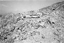 West face of upper adobe platform showing rock retention wall at Site 93