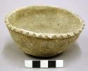 Complete ceramic vessel, scalloped rim, plain
