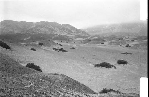 Secondary canal aqueduct along ridge (Feature 10), and La Cumbre in background