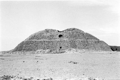 View of huaca from compound at Site 142