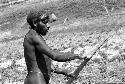 Apeori cleans his digging stick