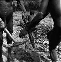 Two men with stone tools