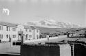 Unidentified landscape -- mountains and buildings