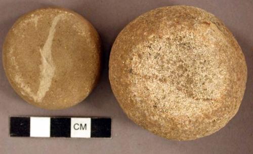 Ground stone, discoidal stones, concave on both sides