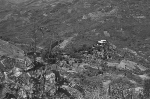 Scenery -- building perched on top of a hill